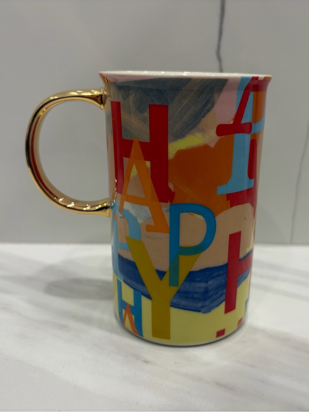 Anthropologie Multicolor Typographic HAPPY Mug with Gold Handle
